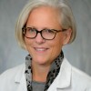 Image of Dr. Kuhns in white coat 